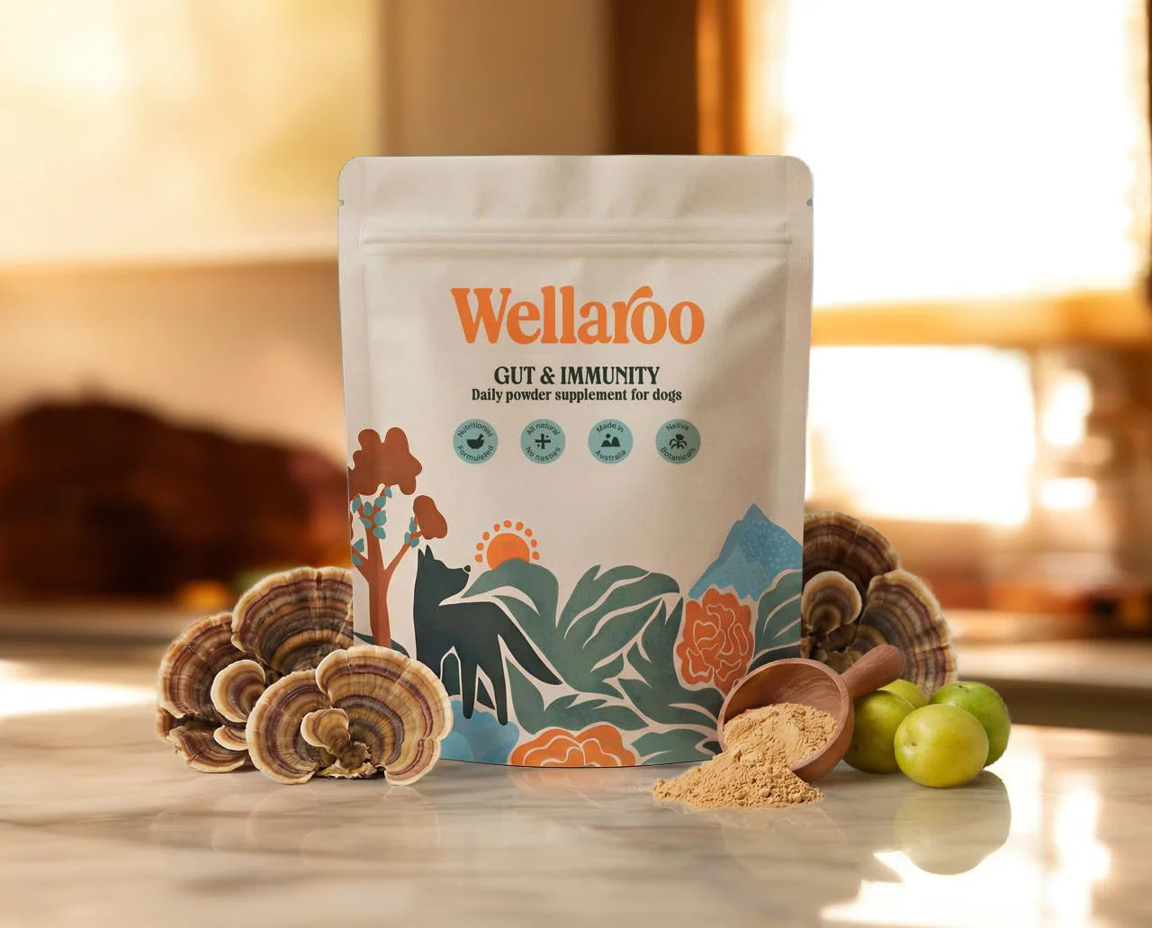 Wellaroo Gut & Immunity daily dog supplement pouch with turkey tail mushroom, powder scoop and native botanicals on a marble kitchen bench