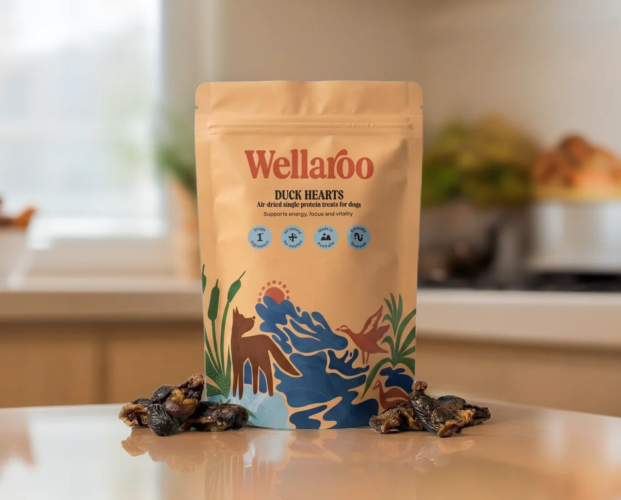Wellaroo Duck Hearts air-dried single-protein dog treats pouch with treats on an oak kitchen bench